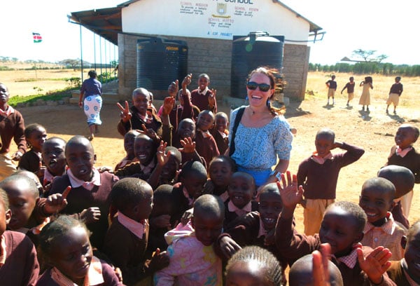 Domonique volunteering in Kenya got a warm greeting at school each morning