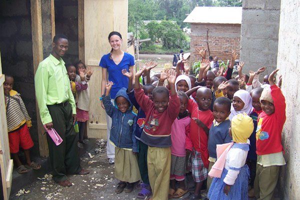 Megan and students at Cheti school where she donated new bathrooms