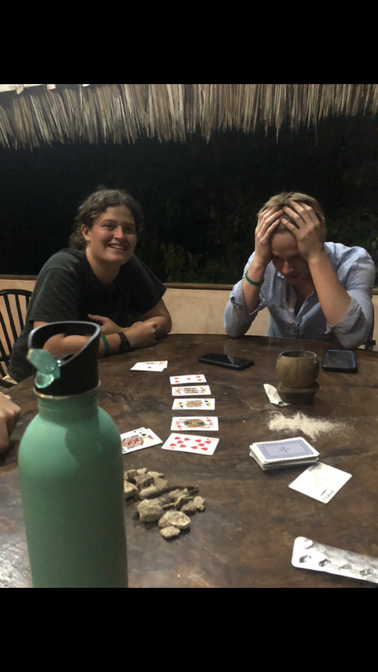 game of rock cards with housemates, staying in Diani- a weekend away from the village