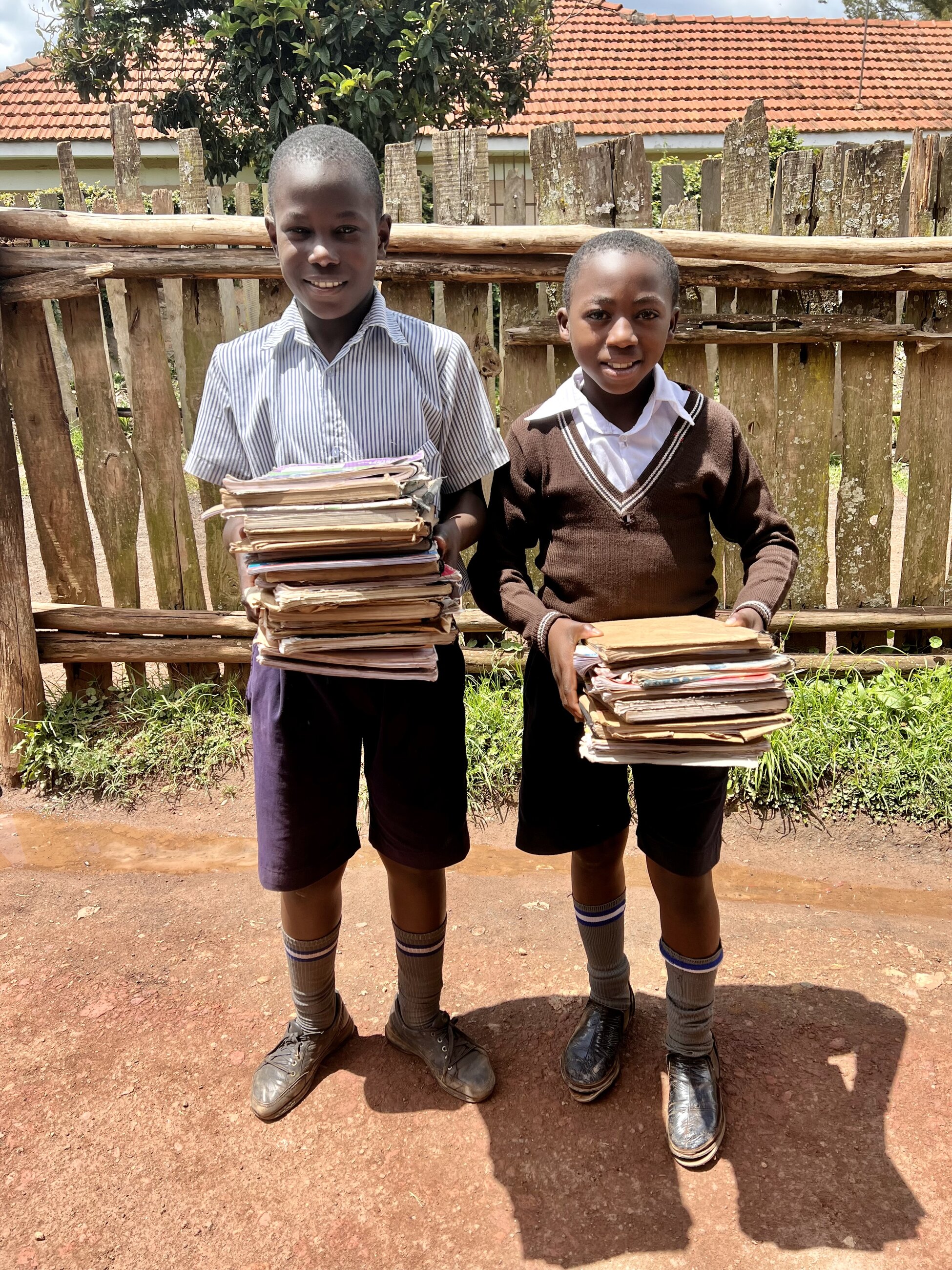 Students carrying books to the classroom