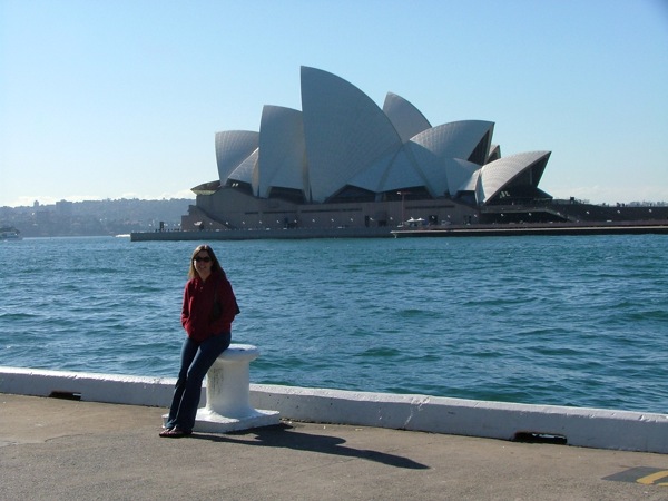 Kathryn lounges by the Sydney Opera House