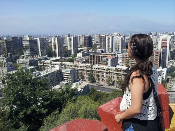 Yasmin overlooking the city skyline of Santiago