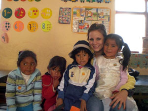 Rebecca with children in Peru