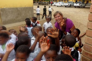 Volunteer playing with children