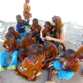 Emma with local children while volunteering in Tanzania with Gap Medics
