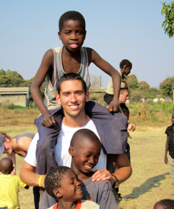 Volunteer with local kids from Zambia