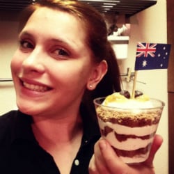 female holding cupcake with Australian flag