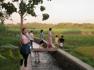 Sian exploring the rice fields with fellow volunteers.