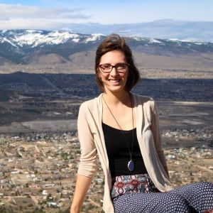 woman smiling with mountains in background