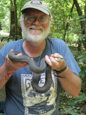 man holding a snake