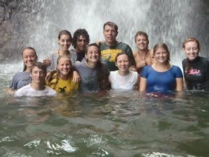 The Leap group enjoying a waterfall while white water rafting.