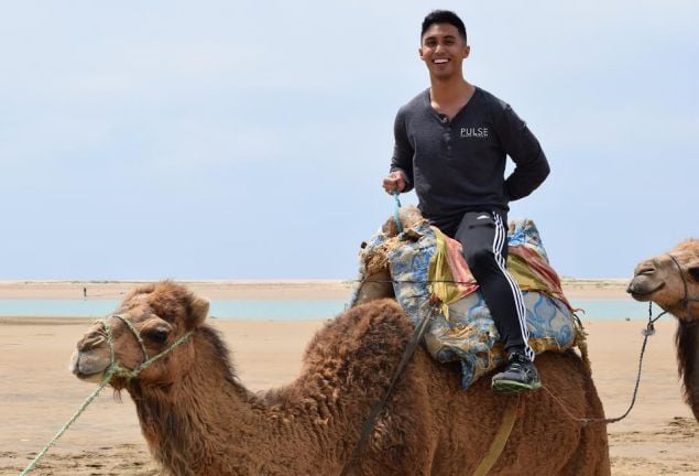 Riding a camel in Morocco