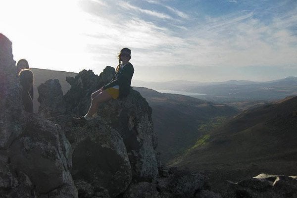 Lauren sitting on top of Gamla Mountain in Israel
