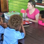 Intern teaching students in Fiji