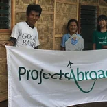 volunteers holding a Projects Abroad sign in the Philippines