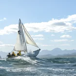 Students breach a wave on a Baja Coastal Sailing expedition.