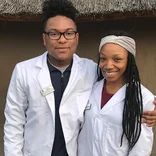 two students in lab coats