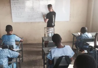 Volunteer given lesson to his students