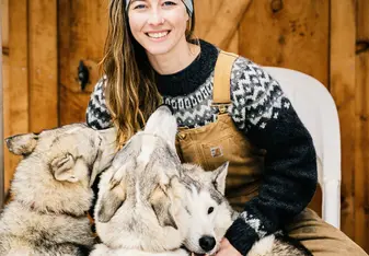 Janna Lee Cushing and Dogs by the cabin