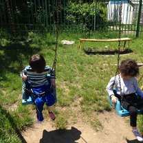 children swinging at the park