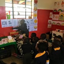 Photo of student teaching his peers