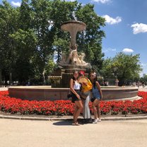 Two friends and I in front of a fountain in Buen Retiro Park, Madrid