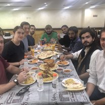 Fellow students enjoying delicious Yemeni food. Sorry y'all, but eating utensils aren't allowed here.