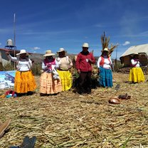 Family on a floating island in Largo Titicaca