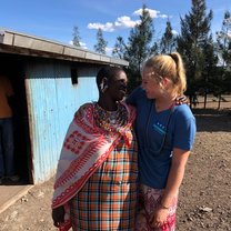 We built and installed a solar panel energy system in this Maasai woman's home! This photo was taken after we finished the installation, and she asked me to take a photo with her. 