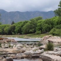 View of a river with mountains in the background.