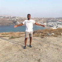 This is a picture of me on top of a hill in Mykonos Greece