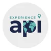 The words Experience API on a gray circle background