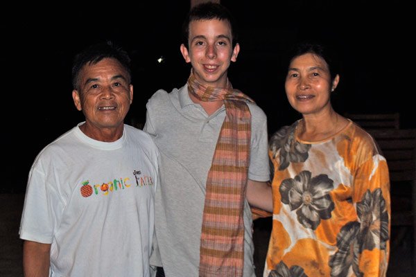 UBELONG volunteer Christian with his host family in Laos