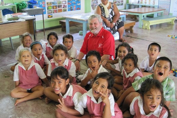 Volunteer with children on the Cook Islands