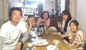 Volunteer having dinner with her host family