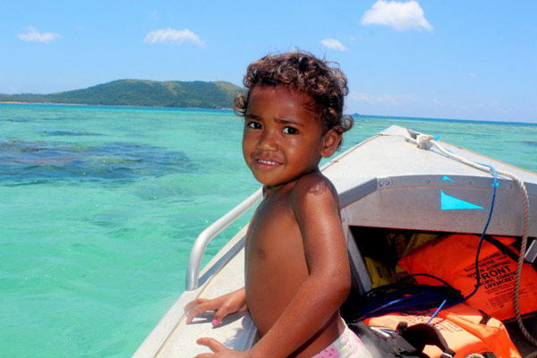 child on a boat in Fiji
