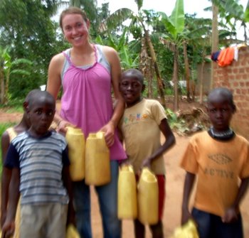 Caitie posing with some new friends in Uganda