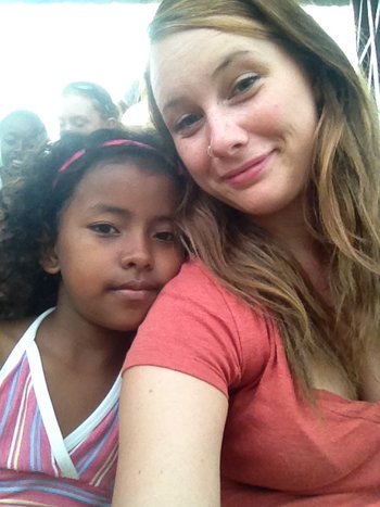 Belle snapping a photo with a local Ecuadorian girl 