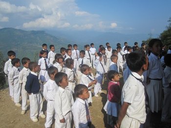 Young Nepalese students lining up outside of school