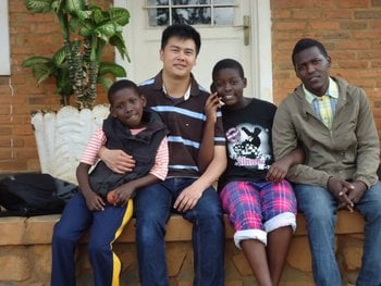 Leandro with some of the children he met while volunteering with GVN in Rwanda