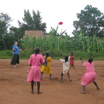 Kelsey playing sports with local kids in Uganda