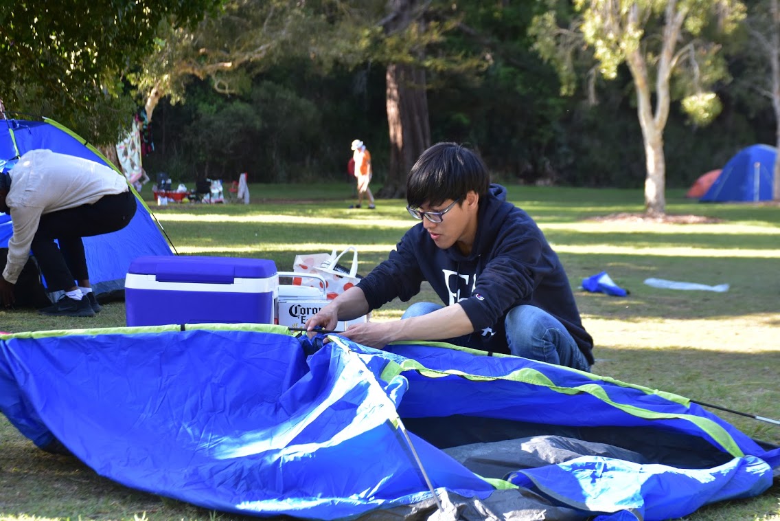 Setting up a tent during the camping trip Preparing to set up a tent during the camping trip