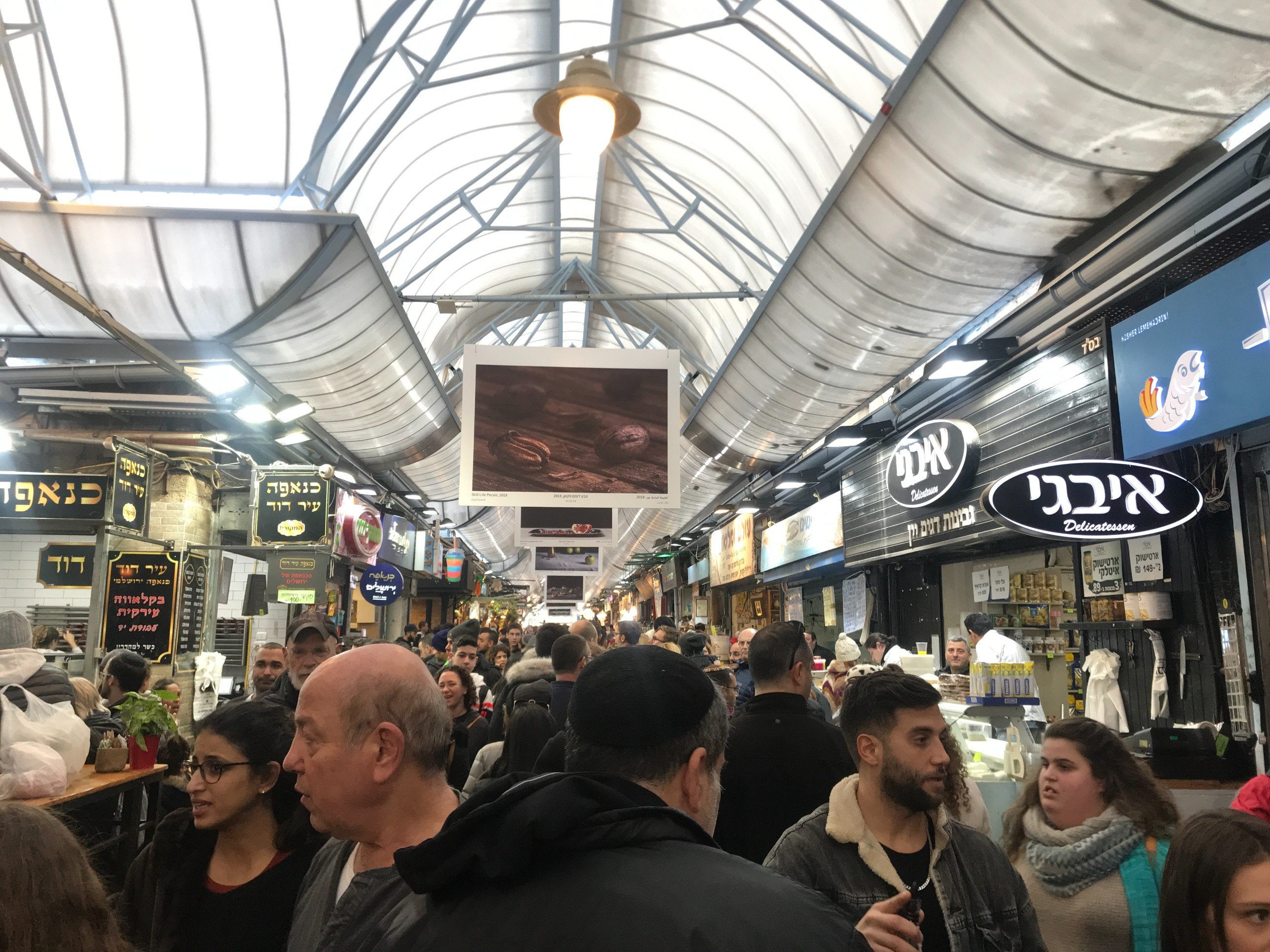 Shuk Machane Yehuda in Jerusalem. You must go on a Friday afternoon and get warm rugalach from Marzipan Machane Yehuda