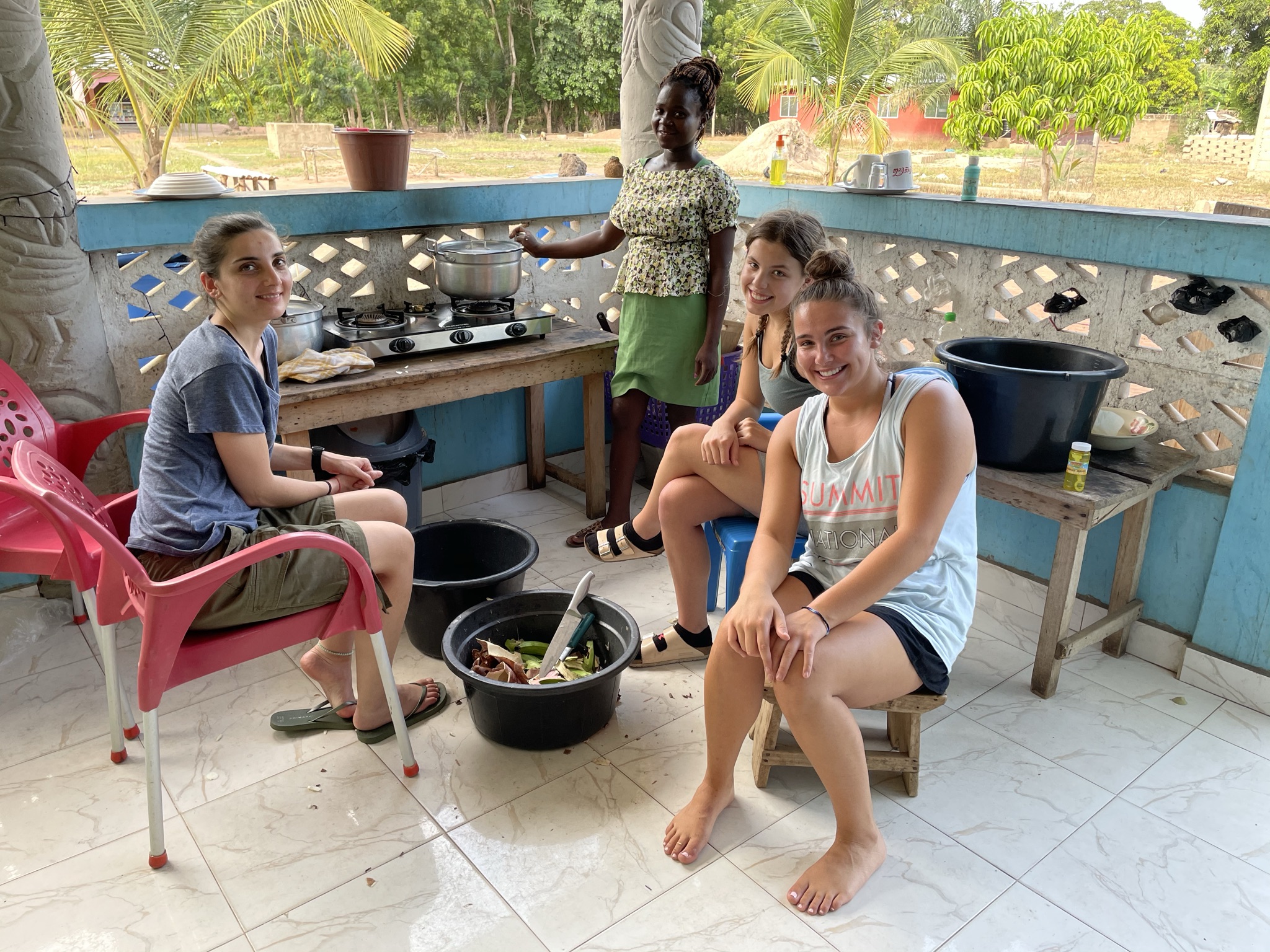 Helping our cook prepare some fufu for dinner