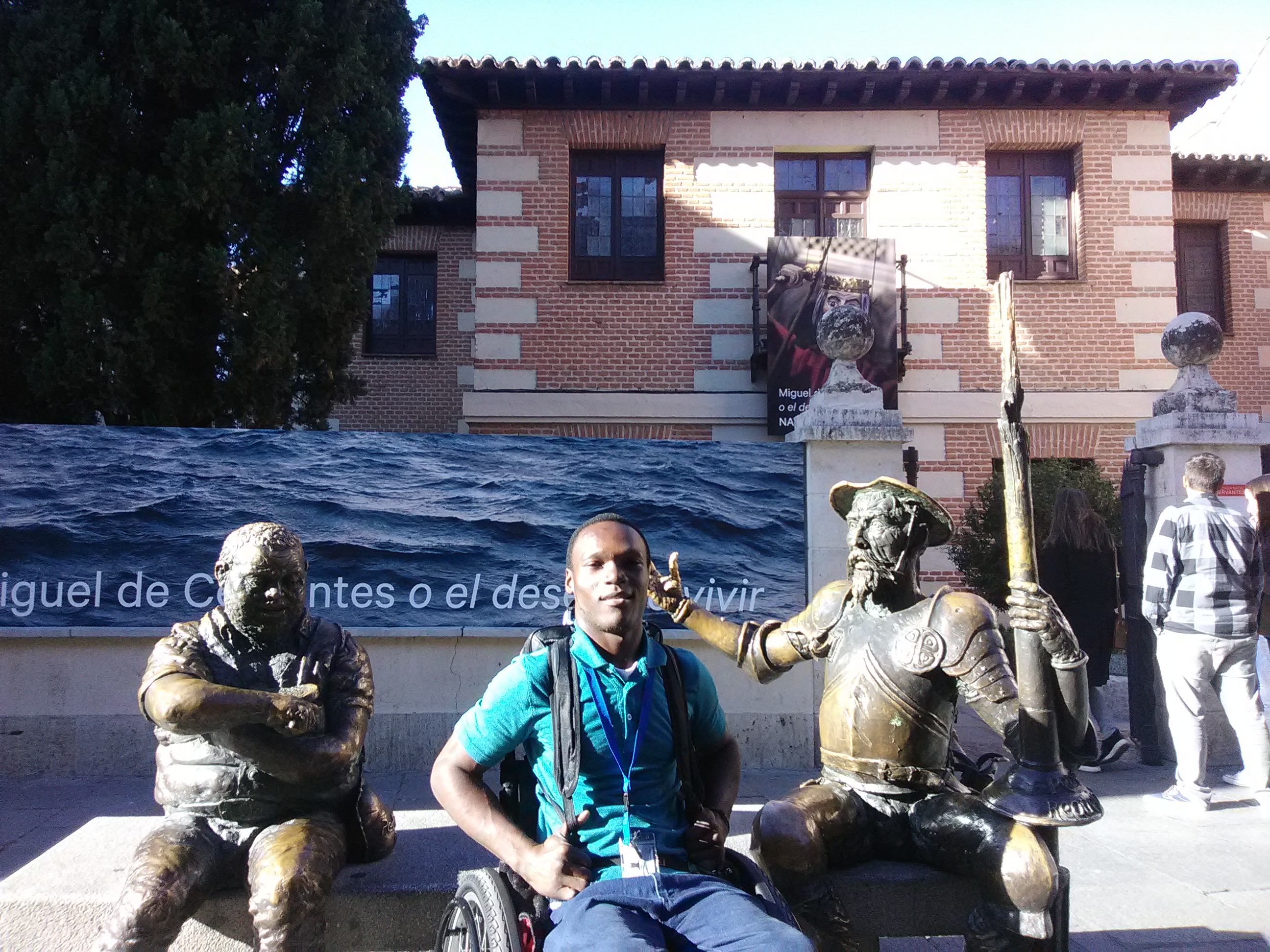 Sitting with Miguel Cervantes and Sancho Panza in front the Miguel de Cervantes Museum in Madrid, Spain 2019