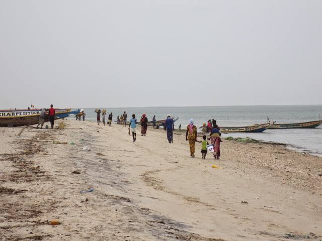 Walking along the beach in Dakar, the capital