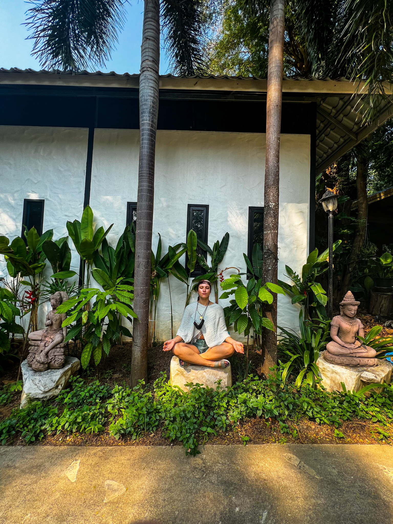 Meditating in the garden at our resort in Erawan National Park