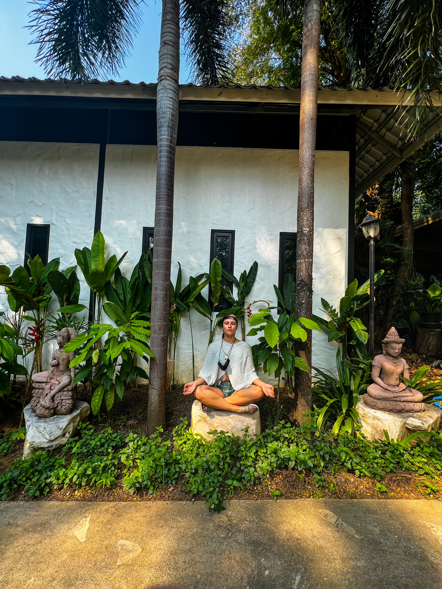 Meditating in the garden at our resort in Erawan National Park 