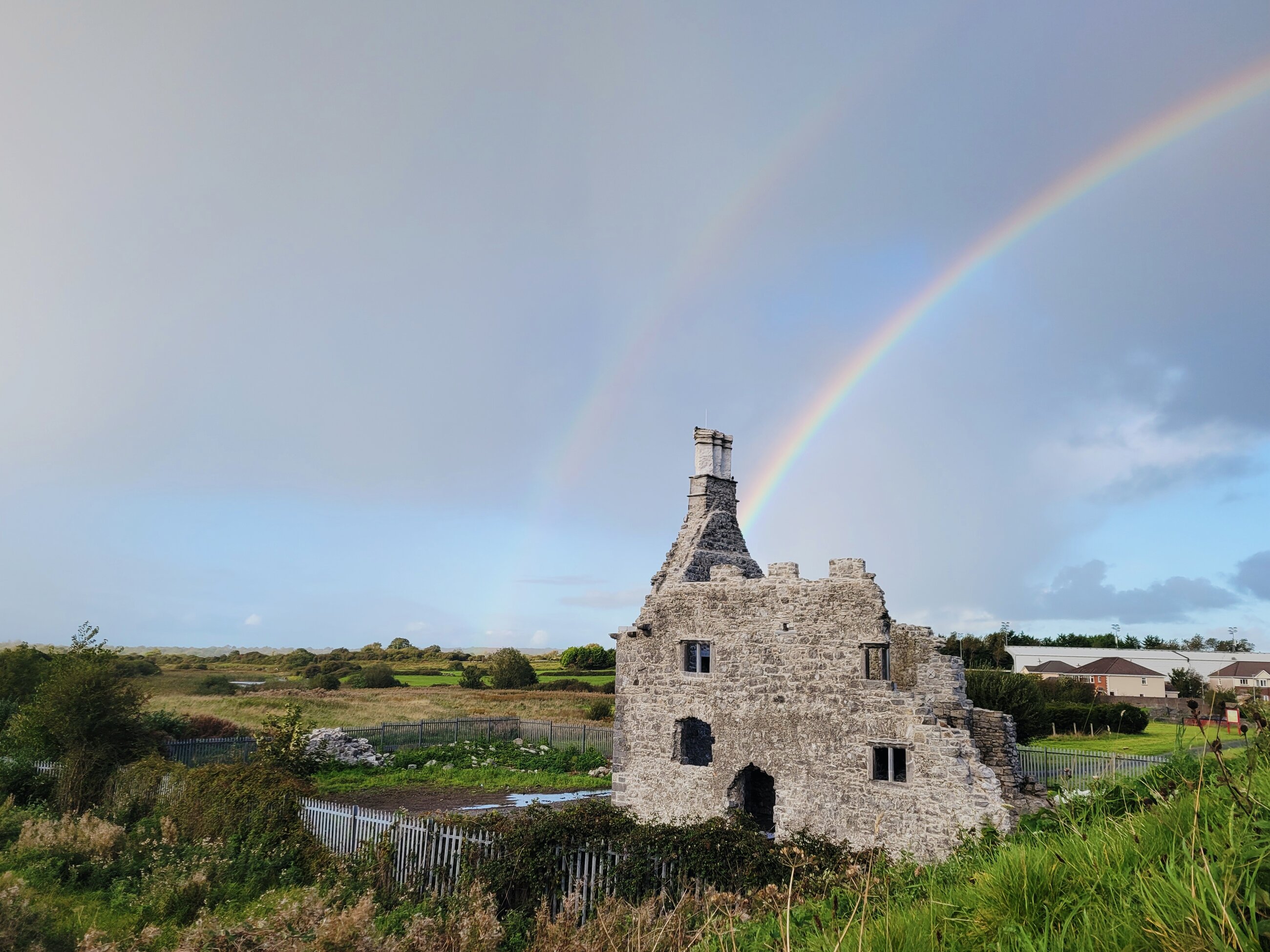 Double rainbow over castle ruins in Galway