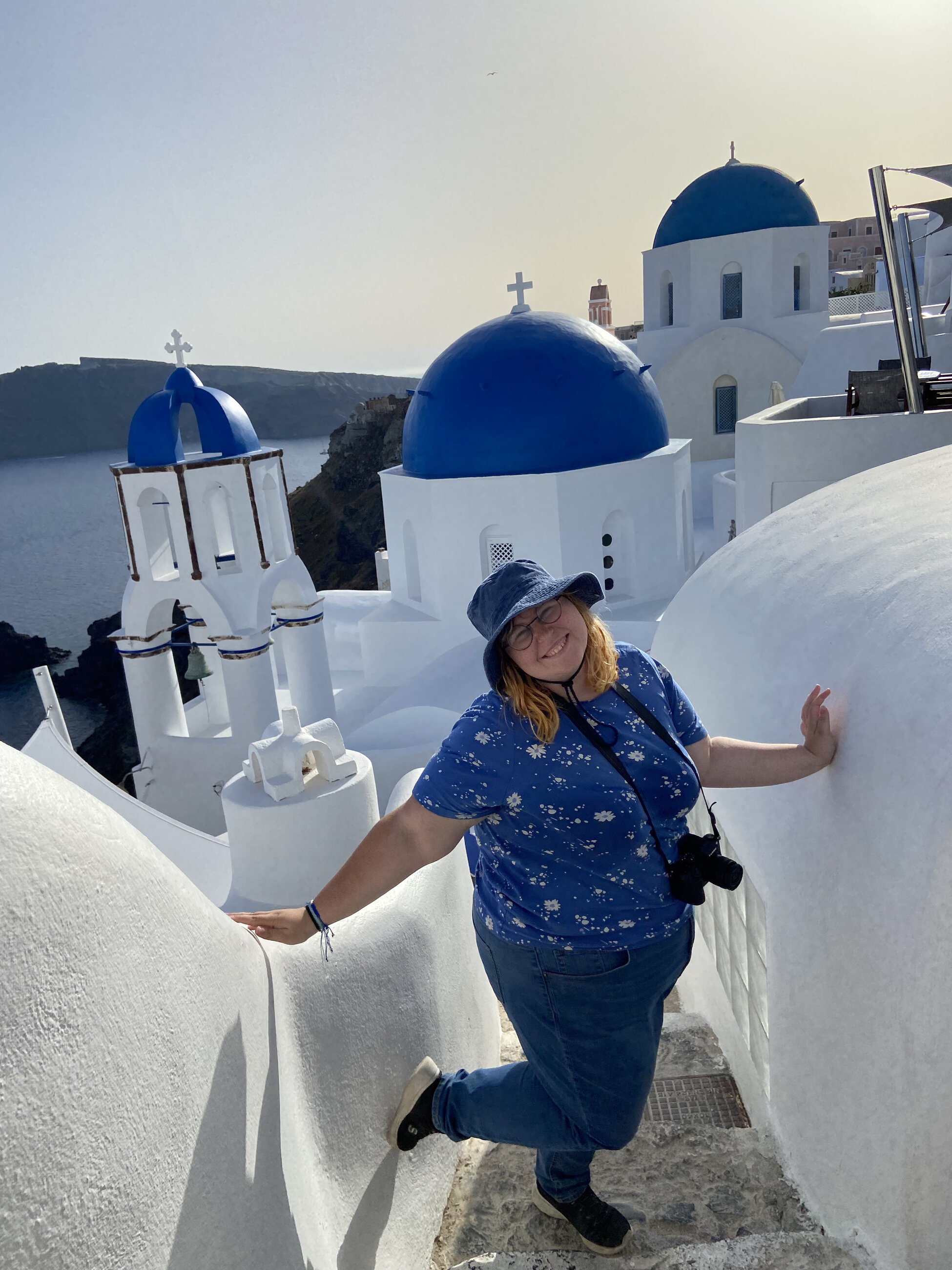 Me with the famed blue domed churches in Oia, Santorini!